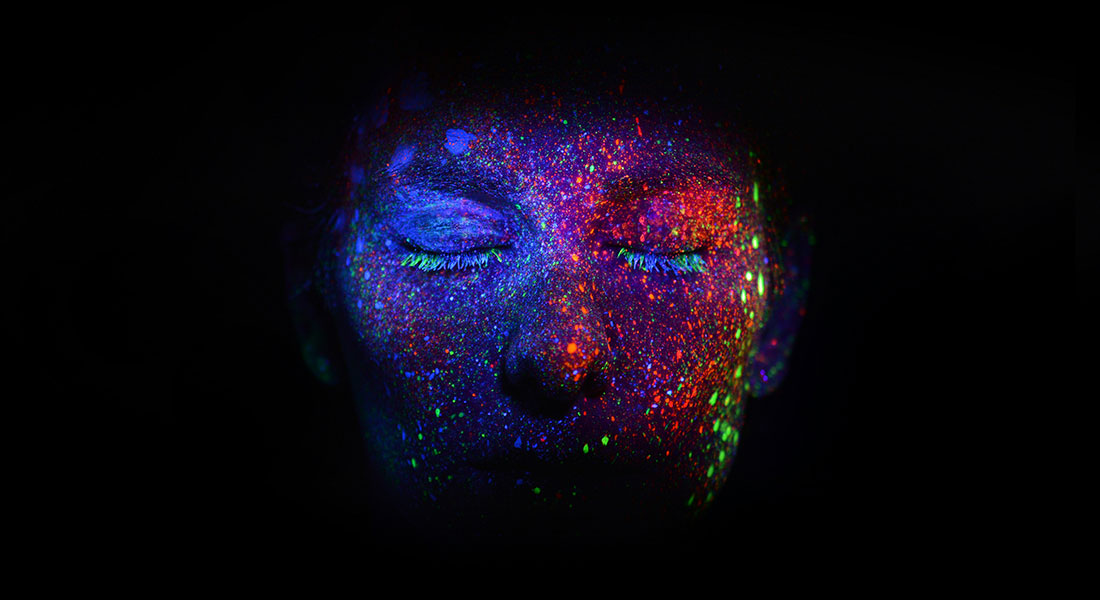 A persons colorful face